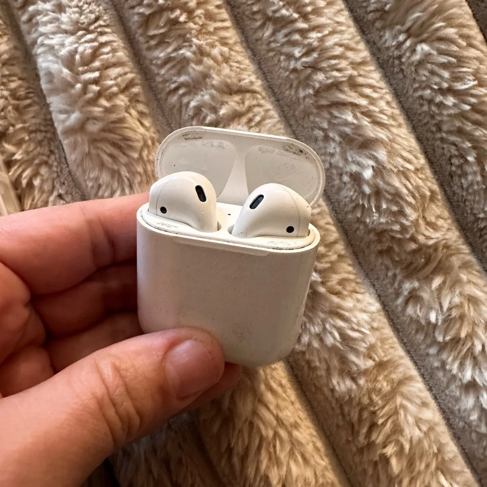 (1) brand new AirPods (1) second hand AirPods total of 2